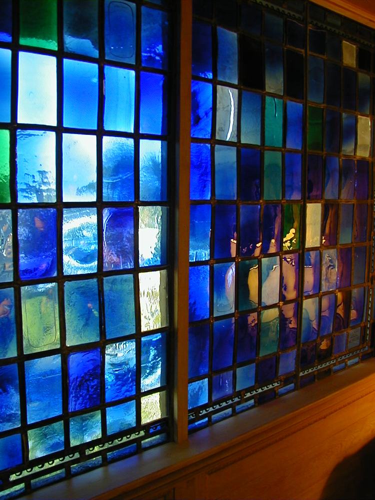 Custom leaded glass wall panels in cobalt blue and emerald tones