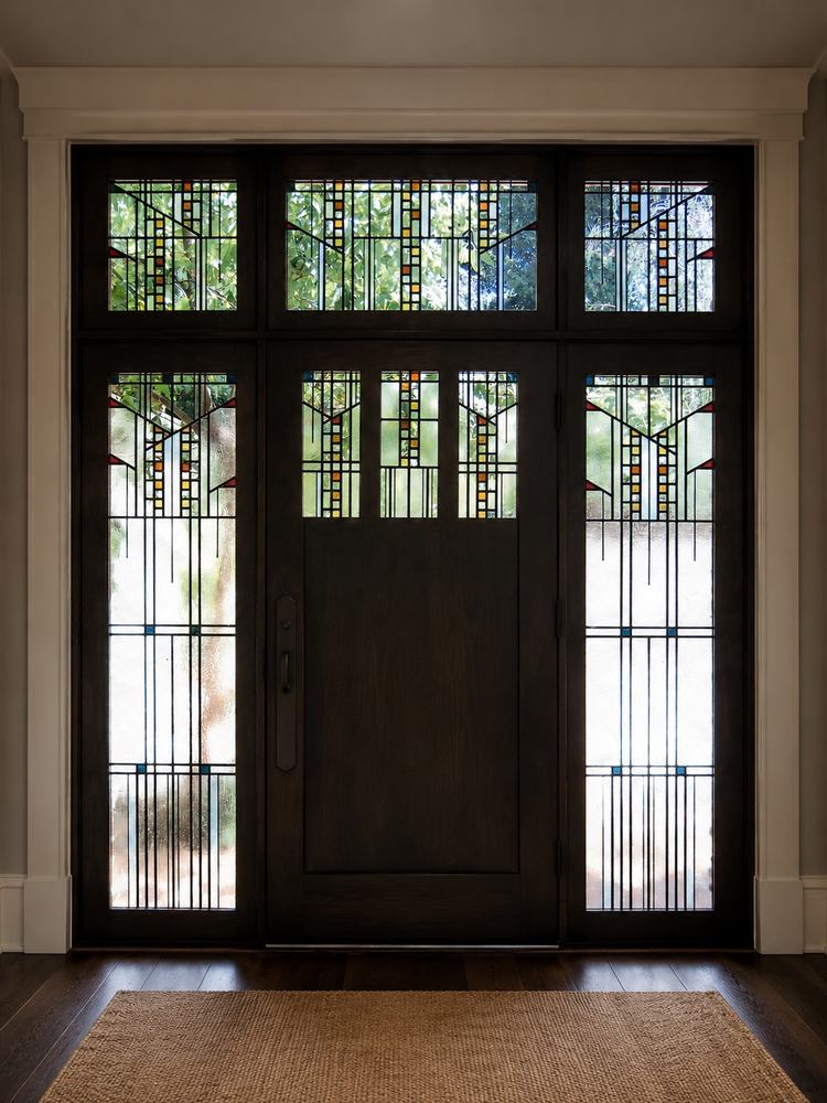 Symmetrical Craftsman-style stained glass entry door with sidelights and transom windows