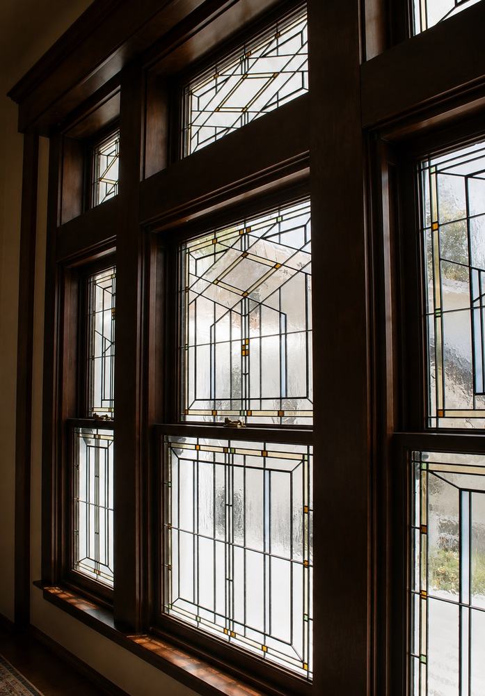 Detail view of Craftsman-style leaded glass windows with geometric Prairie design