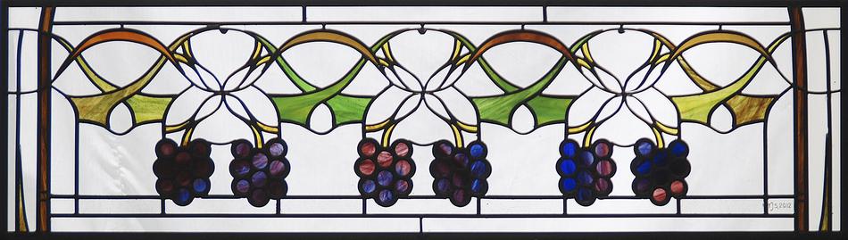 Custom stained glass border panel with grapevine and hanging grape cluster design