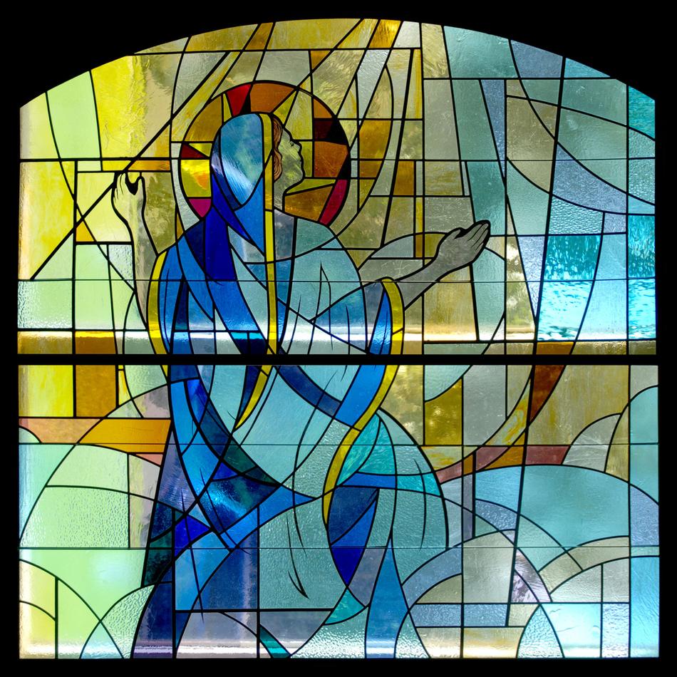 Modern painted stained glass panel depicting an abstract angel figure